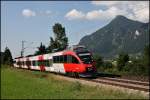 br-4024 4024 067 ist als RB 5125 von Rosenheim nach Telfs-Paffenhofen unterwegs. (Kloster Raisach am 05.08.2009)