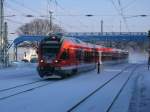 429 030 als RE 13006 Sassnitz-Rostock,am 04.Februar 2012,bei der Einfahrt ...