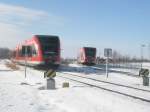 br-646-stadler-gtw-db Hier 646 008-3 als RE6, der von Neuruppin West nach Berlin-Spandau mitgef�hrt wird und im Hintergrund 646 022-4 als RE6 von Wittenberge nach Berlin-Spandau, diese beiden Z�ge trafen sich am 21.2.2010 in Neuruppin West.