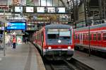 928 212-2 am 25.05 2008 als RE nach Lbeck Hbf im Hamburger Hauptbahnhof.