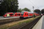 Von links: 648 832-3  Aumhle  als RE74 (RE21218) von Kiel Hbf. nach Husum, 648 855-4  Fehmarn  als RB73 (RB21966) von Kiel Hbf. nach Eckernfrde, ein RE70 (RE21023) von Kiel Hbf. nach Hamburg Hbf. (Schublok war 112 173-0) und eine RB77 (RB21125) von Kiel Hbf. nach Neumnster (Schublok war 143 860-5), Kiel Hbf. am 23.9.2015.  