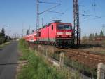 BR 143 151-9 fhrt am 13.10.05 mit einer S-Bahn von Zielitz nach Schnebeck - Salzelmen, hier in Magdeburg - Rothensee.