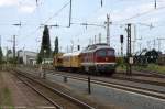 232 550-4 DGT - Deutsche Gleis- und Tiefbau GmbH mit einem Bauzug in Magdeburg-Eichenweiler.