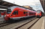 429 530-9 steht am 20.8.2016 als RE9 (RE13011) von Rostock Hauptbahnhof nach Sassnitz zusammen mit 442 841-3 als S3 von Warnemünde nach Güstrow im Rostocker Hauptbahnhof.