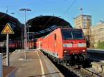 146 007-0 zieht am 10.11.2011 RE1 aus den Aachener Hbf. Rechts im Hintergrund das 1930 erbaute Hochhaus der Aachener Stadtverwaltung mit seiner Wetterstation auf dem Dach.