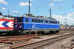 Lokportrait von WRS Ae 1042 007 (ex. ÖBB), als sie am Nachmittag des 20.07.2015 im nördlichen Vorfeld vom Badischen Bahnhof von Basel abgestellt stand und auf ihren nächsten Einsatz wartete.