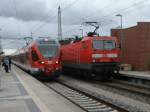 Zugbegegnung,am 10.August 2012,in Bergen/Rgen.143 300 schob ihren RE 13012 von Sassnitz nach Rostock,whrend auf dem Nachbargleis 429 030,mit dem RE 13029 Stralsund-Binz,in Bergen/Rgen eintraff.