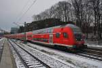 Hier ein RE70 (RE21018) von Hamburg Hbf. nach Kiel Hbf., bei der Einfahrt am 19.1.2016 in Kiel Hbf. Schublok war 112 143. 