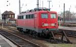 110 284 steht am 12.02.11 vor der Bahnhofshalle von Leipzig abgestellt.