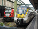 ET 3442 207 als RE 14A nach Rottweil neben dem Abschiedszug mit einer unbekannt gebliebenen Traxx-Lok am letzten Betriebstag der DB auf dem RE Stuttgart - Tübingen, 13.06.2020.