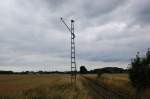 Die Strecke stillgelegt, der Fahrdraht entfernt und der Mast nutzlos.