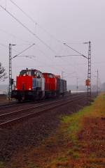 214 011 von NBE und Chemion 203 120 mit einem alten Bahnpostwagen.