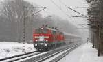 218 397-8 und eine Schwesterlokomotive mit einem IC nach Westerland am 29.01.2010 in Prisdorf.