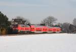 218 412 mit RE 12049 von Worms nach Mainz.Aufgenommen am 05.01.11 bei Pfeddersheim.