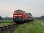 Die 218 440 mit einem Pilgerzug am 11.06.2011 unterwegs bei Alttting. 