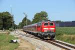 218 435-6 mit dem RE 57414 nach Memmingen bei der Ausfahrt aus Stetten (Schwab) am 18.07.2012