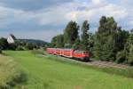 218 427-3 mit einem Regionalexprss nach Lindau am 31.07.2012 in Aulendorf