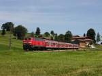 Die 218 461 mit einer RB nach Füssen am 19.07.2014 unterwegs bei Seeg.