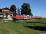 Die 218 469 mit einem RE nach Füssen am 09.10.2014 unterwegs bei Seeg.