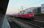 218 488-5 schiebend an einem RE. Aufgenommen am 23.04.2014 an der Station München-Laim.