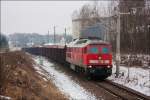 Am 12.02.2013 fhrt 241 353 bei winterlichen Wetter aus dem Bahnhof in Frohburg.