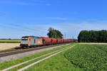 246 010 mit einem Düngerzug am 03.07.2018 bei Langenisarhofen.