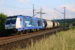 Die 246 011-1 der IGT kam am 01.06.2014 mit einem Getreidezug aus Richtung Eichenberg in Fahrtrichtung Norden am BÜ zwischen Friedland(HAN) und Eichenberg vorbei.