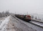 Hvle Tiger V330.4 (250 004-9) ist am 23.01.14 mit einem Kesselzug im Vogtland unterwegs. Hier zusehen in Syrau/V.