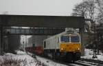 Die 247 031-8 fuhr am 06.01.2011 durch Bottrop, bei leichtem Regen.