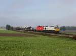 Die 247 056 und die 1116 136 mit einem Gterzug am 19.10.2013 unterwegs bei Dorfen.