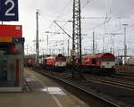 Die Class 66 DE6311  Hanna  von Crossrail fährt mit viel Dieselpower mit einem  Containerzug aus Ludwigshafen(D) nach Zeebrugge-Ramskapelle(B)  bei der Ausfahrt aus Aachen-West und fährt in