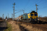 Freightliner 266 115 am 04.03.2023 mit einem leeren Getreidezug von Mukran am Abzweig Srg in Stralsund aufgenommen.