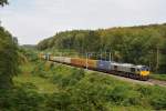 Die DE6307 von Crossrail rollt mit einem langen Containerzug von Aachen-West kommend durch den Wald bei Moresnet-Chapelle in Richtung Montzen. Aufgenommen am 21/08/2011.