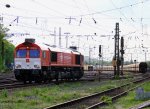 Die Class 66 DE6310  Griet  von Crossrail rangiert in Aachen-West bei der Abendsonne mit Wolken am 9.5.2012.