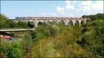 Am 11.09.2012 konnte der lange Kohle-Leerzug aus dem Kraftwerk Chemnitz zurck zum Tagebau Profen bei berfahrt ber das Bahrabachtalviadukt fotografiert werden.