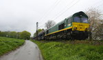 Die Class 66 RL002/V270 von der Rurtalbahn-Cargo kommt die Gemmenicher-Rampe herunter nach Aachen-West mit einem langen Mazda-Autozug aus Montzen(B) nach Aachen-West(D).