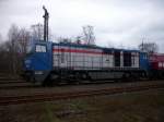 Eine MaK G2000 und eine V160 mit leeren Holzwaggons in Munster.