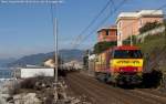 The G2000 n. 33 of ArenaWays transit after the station of Cavi di Lavagna with a test train (February 5, 2011).