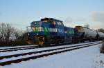 Mit einem Kalksilowagenzug kommt die NIAG 31/9880 1277 802-5 D-VL bei Kapellen Erft am Fotografen vorübergefahren. 24.1.2014