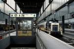 360 335-4 schiebt 1992 den Lufthansa Airport-Express aus dem Stuttgarter Hauptbahnhof