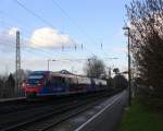 Zwei Euregiobahn (RB20) aus Eschweiler-Sankt-Jöris nach Düren-Stolberg-Altstadt und kommen die Kohlscheider-Rampe hoch aus Richtung Herzogenrath und halten in Kohlscheid und fahren in