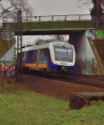 Unter der Stadtbahnunterfhrung bei Osterath Grgesheide kommt der MWB Triebwagen 648 420 und im Anhang den 648 429 als RE10 nach Dsseldorf hindurch gefahren.