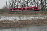 Bei Eriskirch befindet sich am 15.02.2021 RB 93 / RB 17717 auf der Fahrt von Friedrichshafen nach Lindau-Insel