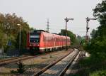 Am Abend des 1. Mai 2009 durcheilen zwei 612er als RE 3940 von Sonthofen nach Ulm den Bahnhof von Vhringen.