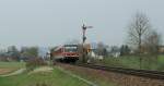 Badische Nebenbahnromantik im Schweizerischen Klettgau: Der VT 628/928 267 hat als RB 31243 gerade den Bahnhof Wilchingen-Hallau verlassen und dieselt nun Richtung Schaffhausen. 
8. April 2010