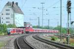 Alltag in Ansbach im August 2005: Ein VT 642 aus Windsbach und eine 143 mit RB aus Nürnberg begegnen sich im östlichen Weichenbereich.