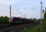 Zwei Euregiobahn (RB20) aus Heerlen(NL)-Düren-Stolberg-Altstadt aus Richtung Herzogenrath,Kohlscheider-Bahnhof und fährt in Richtung Richterich,Laurensberg ,Aachen-West. Aufgenommen bei Wilsberg in Kohlscheid bei schöner Abendsonne am Abend vom 30.4.2014. 