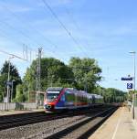 Zwei Euregiobahn (RB20) kommt aus Richtung Aachen-West,Laurensberg,Richterich und fährt durch Kohlscheid und fährt in Richtung Herzogenrath bei schönem Sonnenschein am Morgen vom 23.6.2014.