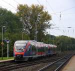 Die Euregiobahn (RB20) kommt aus Langerwehe-Stolberg-Altstadt nach Heerlen(NL) aus Richtung Aachen-West,Laurensberg,Richterich und hält in Kohlscheid und fährt in Richtung Herzogenrath.
Bei Sonne und Regenwolken am Morgen vom 9.10.2014.