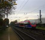 Ein Nachschuss von der Euregiobahn (RB20) aus Langerwehe-Stolberg-Altstadt nach Heerlen(NL) aus Richtung Aachen-West,Laurensberg,Richterich und hilt in Kohlscheid und fährt in Richtung Herzogenrath. 
Bei Sonne und Regenwolken am Morgen vom 11.11.2014.